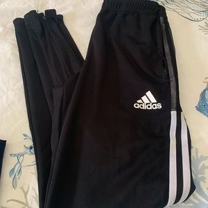 Adidas black track pants men size small. Gently used. Zippered at ankle